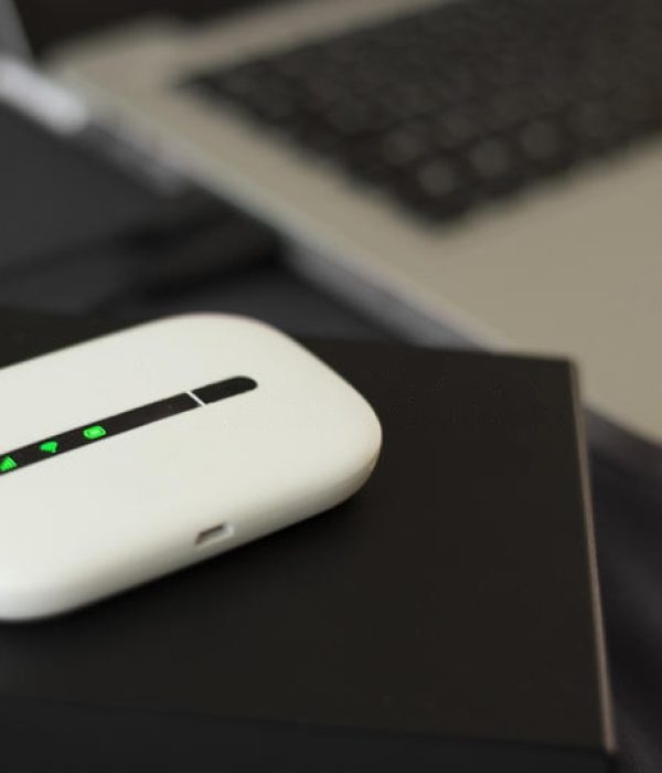 g-mini-wifi-router-external-hard-drive-case-next-to-laptop-54512428-transformed